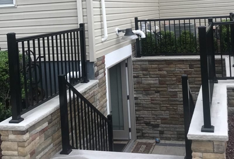 Basement side entrance with railings built by Nanak Construction